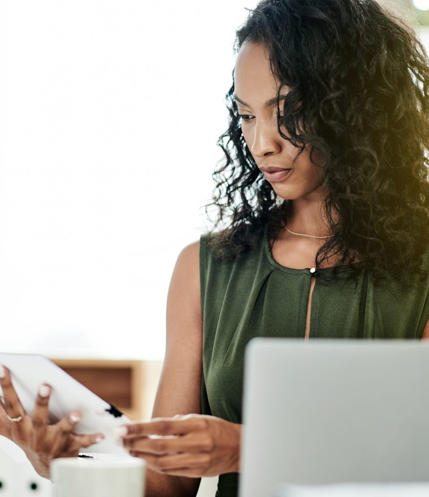 a businesswoman working on her tablet